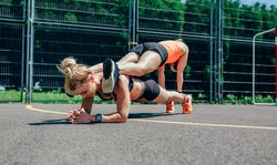 Sportswomen doing partner training