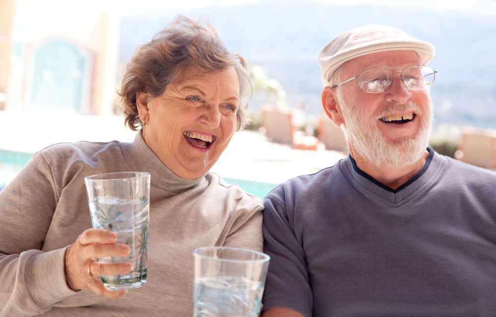 Happy Mature Adult Couple with Drinks