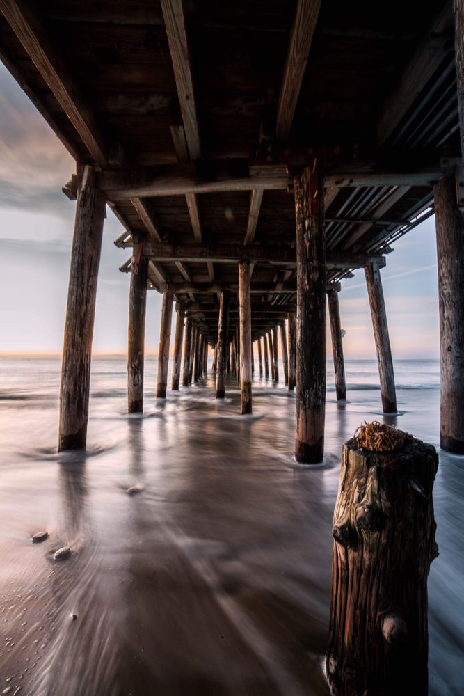 Worm view of wooden dock on beach