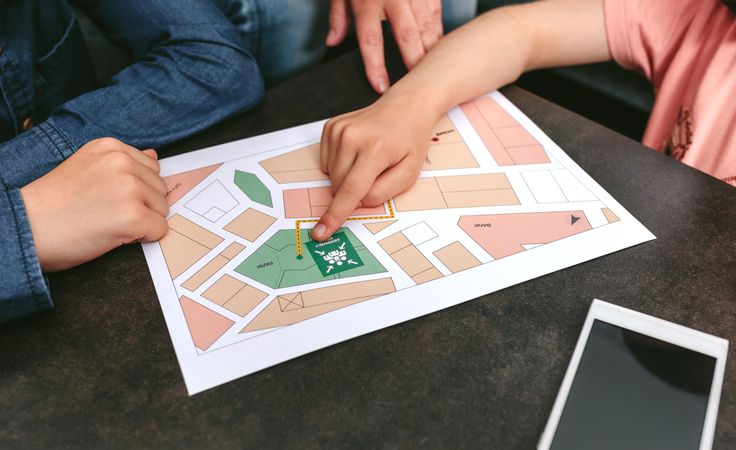 Unrecognizable family looking assembly point map