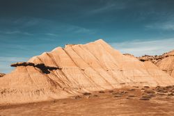 Desert cliffs under blue sky in landscape