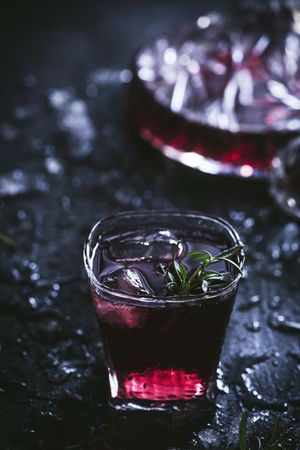 Glasses and carafe with red wine on table