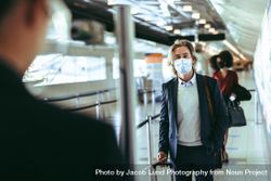 People traveling by airplane during covid-19 wearing face masks 5oj6G0