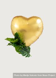 Heart balloon golden with green tropic leaves as decoration 47W6g4