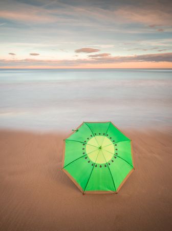 Umbrella on beach near sea