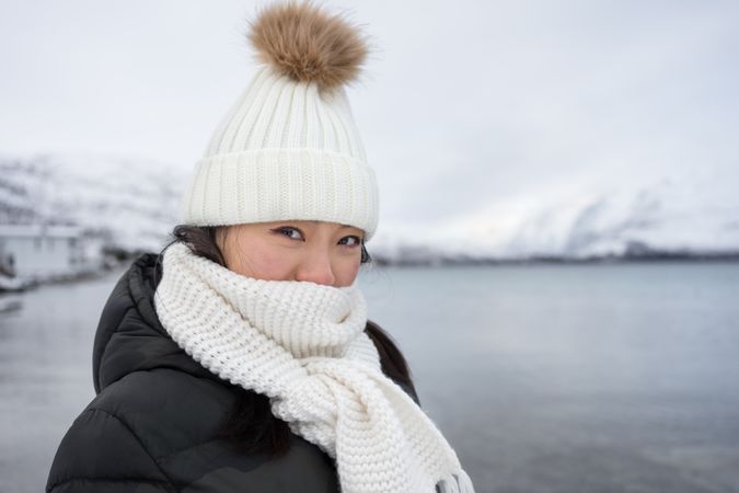 Joyful young woman in warm clothes