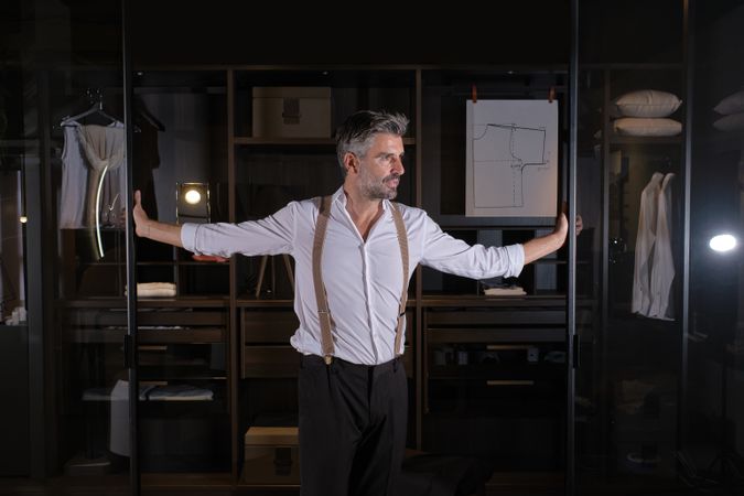Man standing at entrance of wardrobe