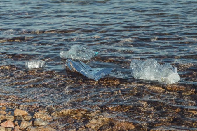 Plastic bottle lying on seashore