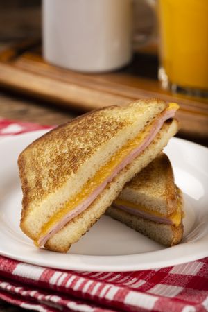 Grilled ham and cheese. Sandwich with cheese and ham on grill.