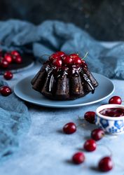 Still life of small chocolate cherry bundt cake