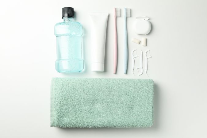 Flat lay with tools for dental care on white background