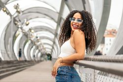 Portrait of a Black young woman enjoying the summer in the city