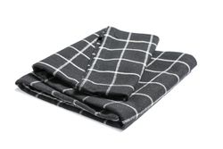 Folded fabric napkin isolated on plain background