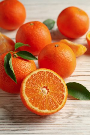 Ripe sweet mandarins on wooden background, top view