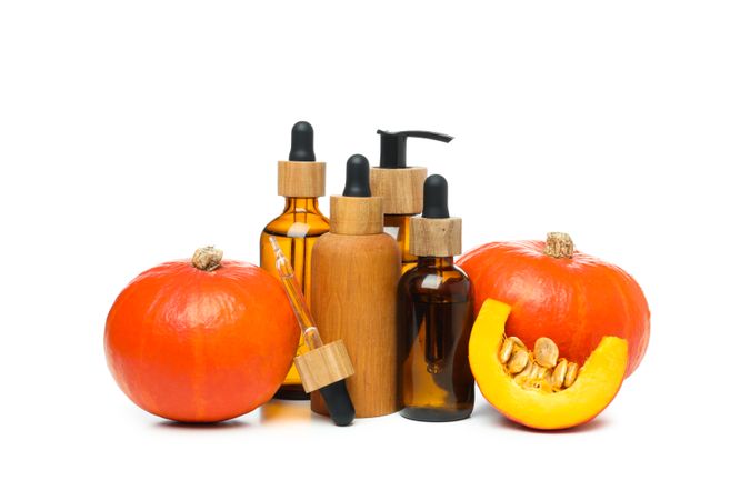 Concept of different cosmetic products, Pumpkin cosmetics, isolated on light background