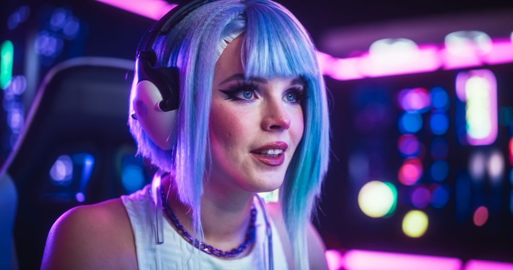Close Up Portrait of a Young Female Wearing Headphones, Talking with Friends Online on a Computer.
