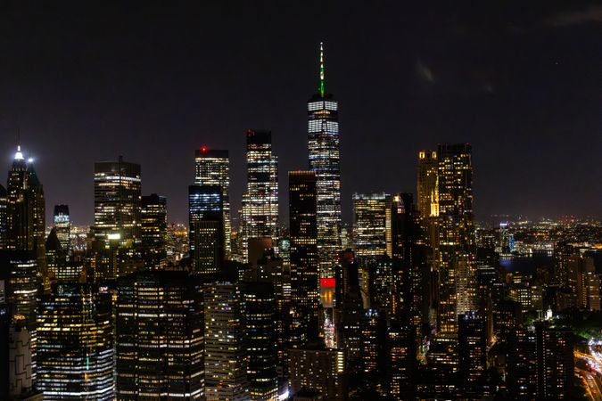 Aerial View of Manhattan Architecture at Night. Evening Shot of Financial Business District from a Helicopter. Scenery of Historic Office Towers, Illuminated Skyscrapers