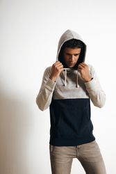 Solemn looking man in hoodie sweater