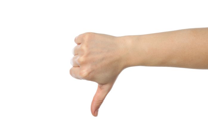 Female hand thumb down, isolated on blank background