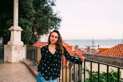 Casual woman against cityscape