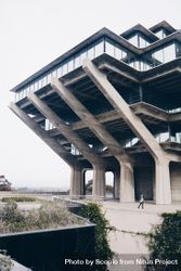 Person standing under Geisel Library 0yOqL4
