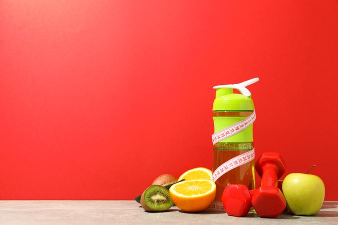 Loss weight accessories on grey table against red background