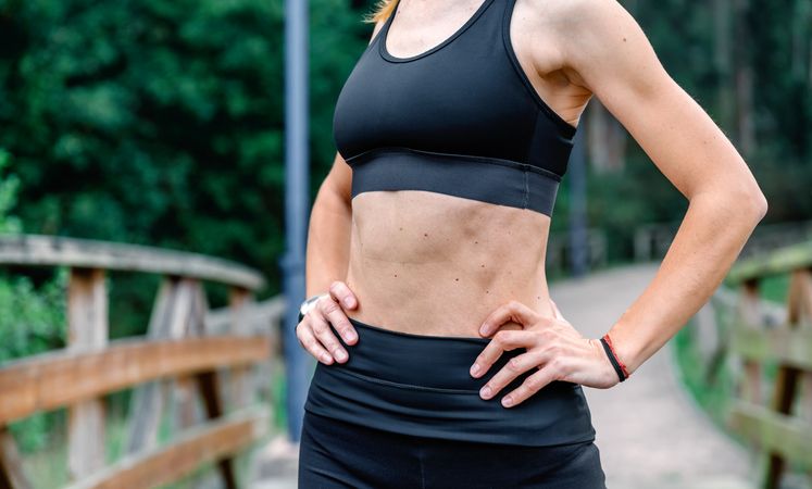 Athlete woman posing with sportswear