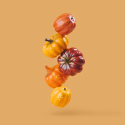 Autumn pumpkins with orange background