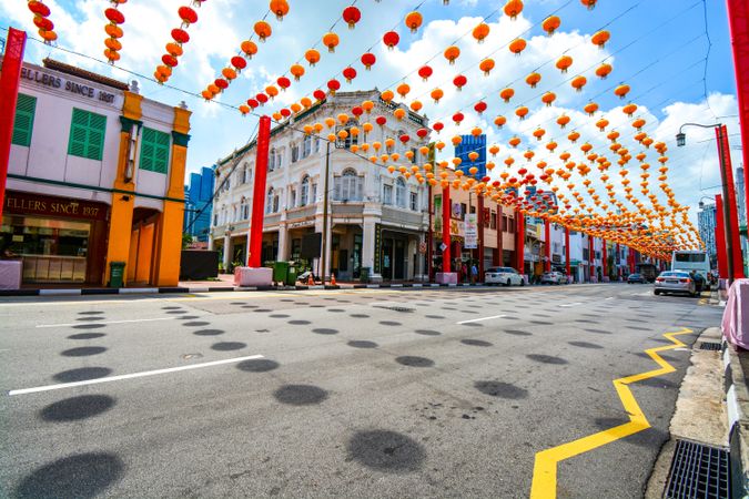 Street decorated with Chinese New Year red Lanterns under blue sky in Singapore
