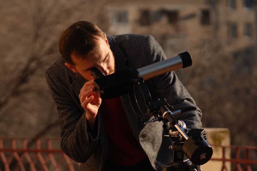 Dedicated observer inspects solar activity with a rooftop telescope