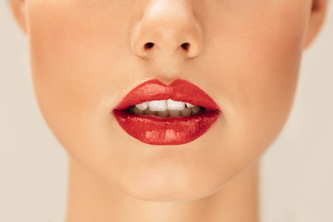 Cropped shot of lips with red lipstick