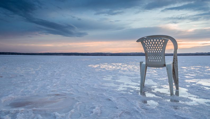 Chair on salt mine during sunset