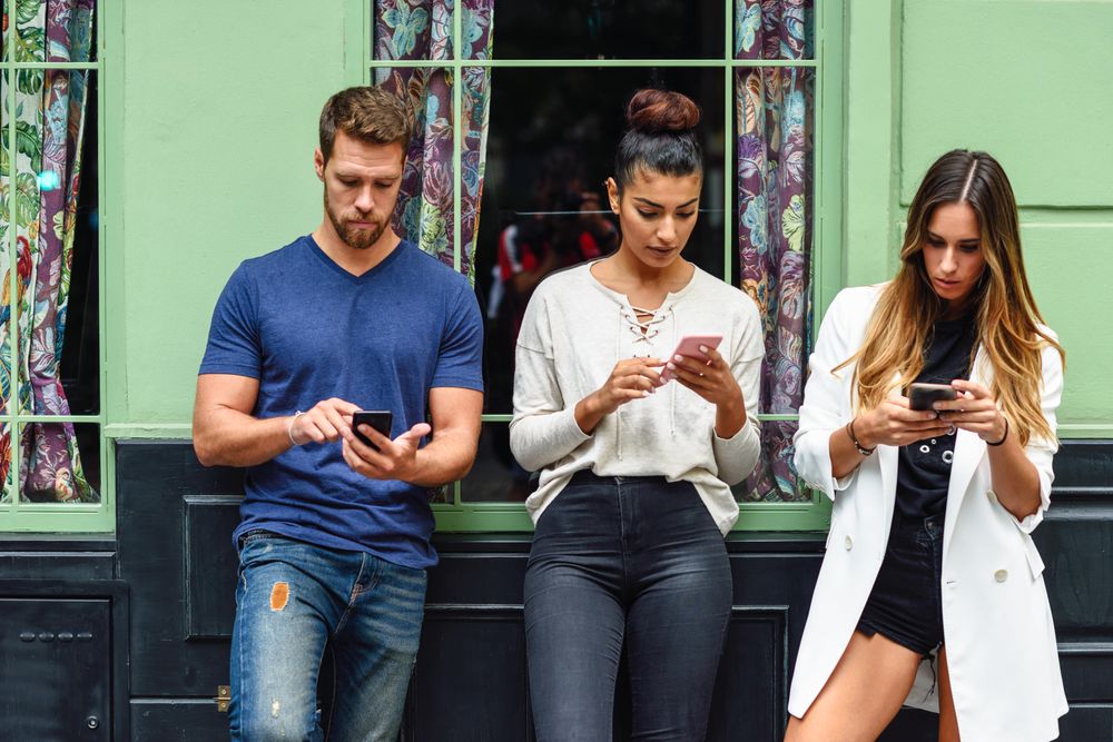 Multiracial group of friends chatting outside