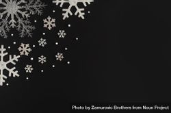 Silver holiday snowflakes on dark background 0ygxa4
