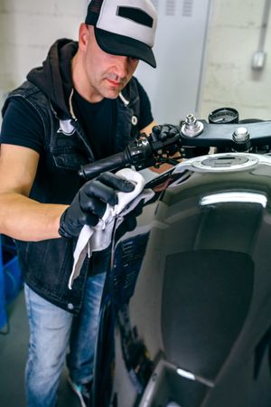 Mechanic cleaning a motorcycle