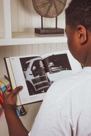 Teenage boy holding a book