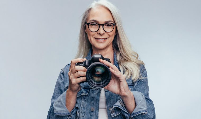 Professional female photographer with camera