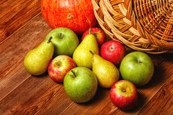 Wooden table with autumn fruit