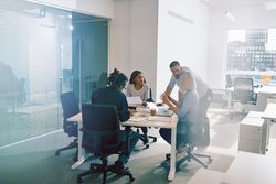 Multi-ethnic group of colleagues brainstorming together