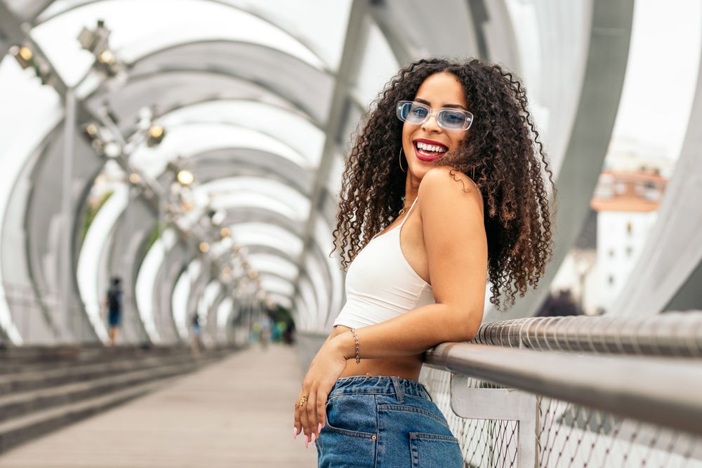 Portrait of a Black young woman enjoying the summer in the city