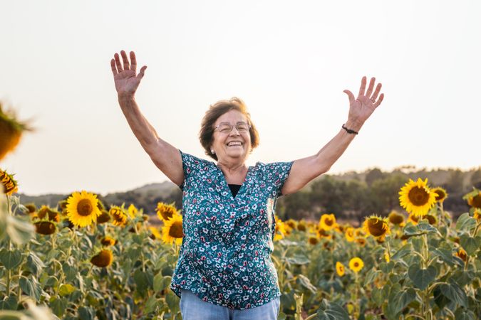 Mature woman in a field of sunflowers