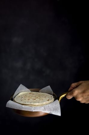 Woman's hands holding Mexican Tacos