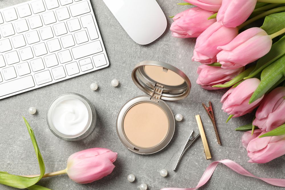 Composition with pink tulips on grey background, top view