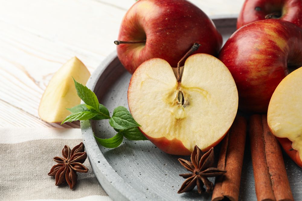 Plate of apples, anise and cinnamon sticks