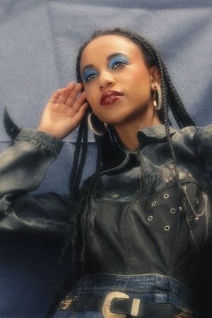 Woman in leather jacket and blue eye shadow