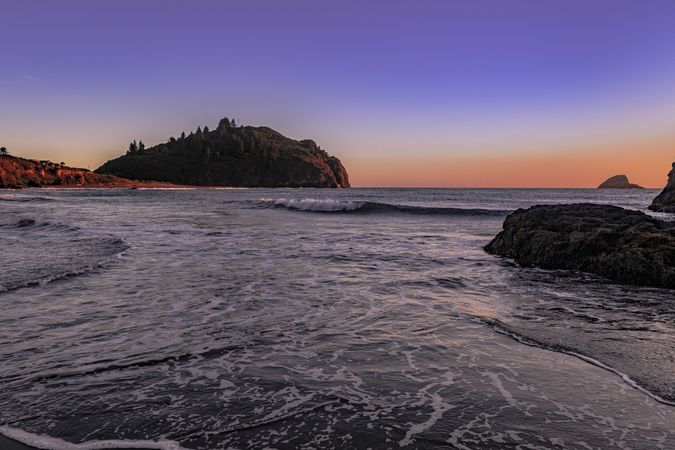 Pacific Ocean coast with clear colorful at sunset