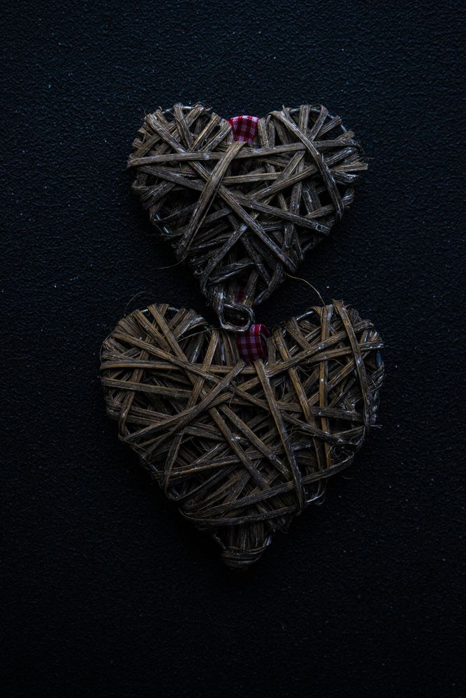 St. Valentines card concept with two weaved hearts