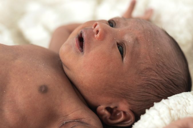 Newborn baby on soft blanket