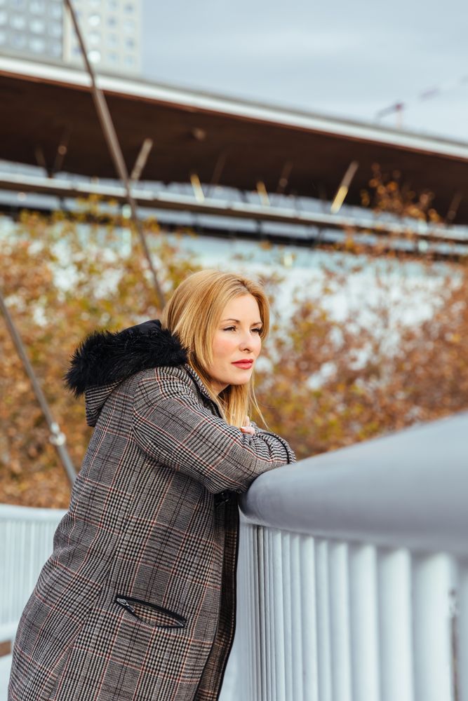 Blonde woman posing in the city