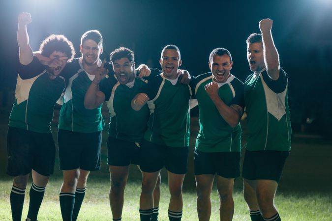 Professional rugby players celebrates a victory on a sports arena